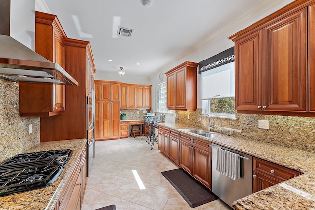 kitchen featuring dishwasher, sink, gas cooktop, light stone counters, and wall chimney exhaust hood