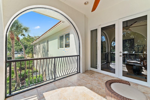 balcony featuring french doors and ceiling fan