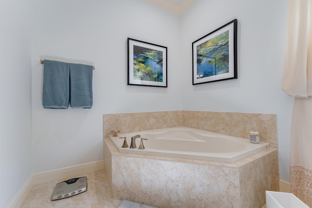 bathroom featuring tiled tub and ornamental molding