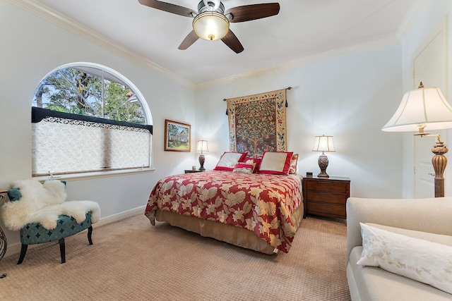 bedroom featuring crown molding, light colored carpet, and ceiling fan