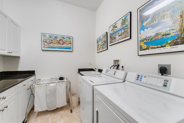 laundry area with sink, cabinets, and washing machine and clothes dryer