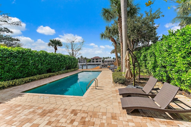 view of swimming pool with a patio area