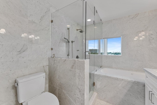 full bathroom featuring vanity, separate shower and tub, tile walls, and toilet