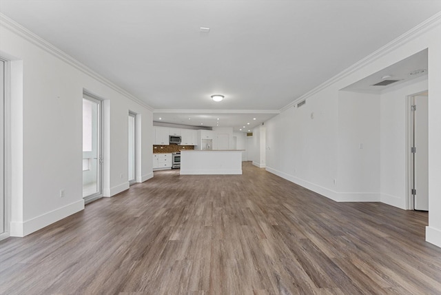 unfurnished living room with ornamental molding and wood-type flooring