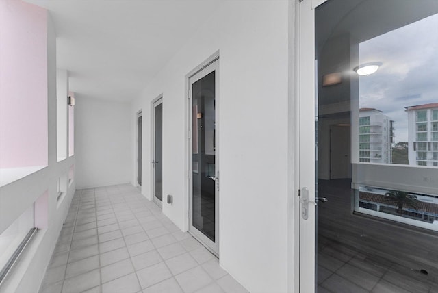 hallway featuring light tile patterned flooring