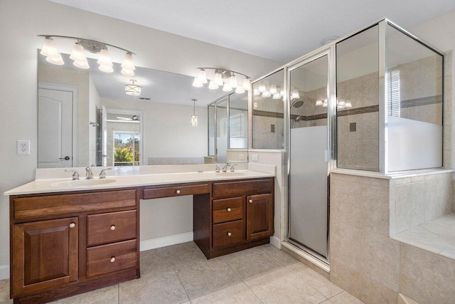 full bathroom featuring tile patterned flooring, a sink, a shower stall, and double vanity