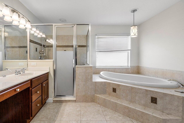 full bath featuring tile patterned flooring, vanity, a shower stall, and a bath