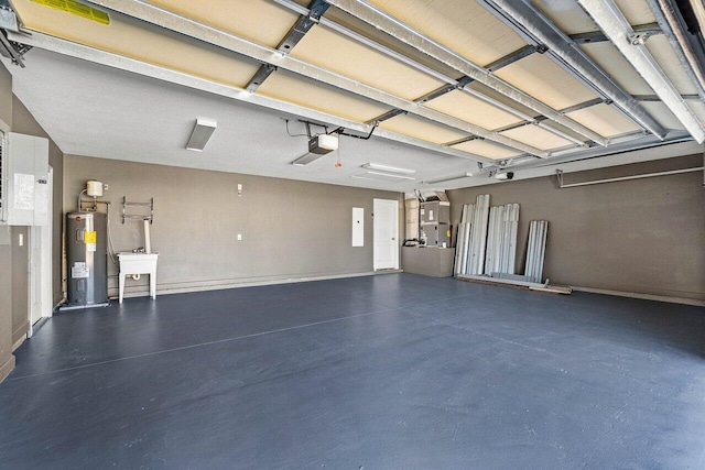 garage featuring a sink, electric water heater, and a garage door opener