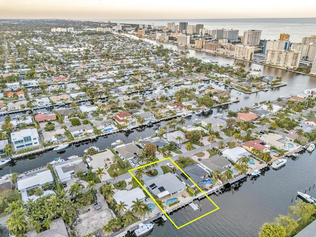 aerial view at dusk with a water view