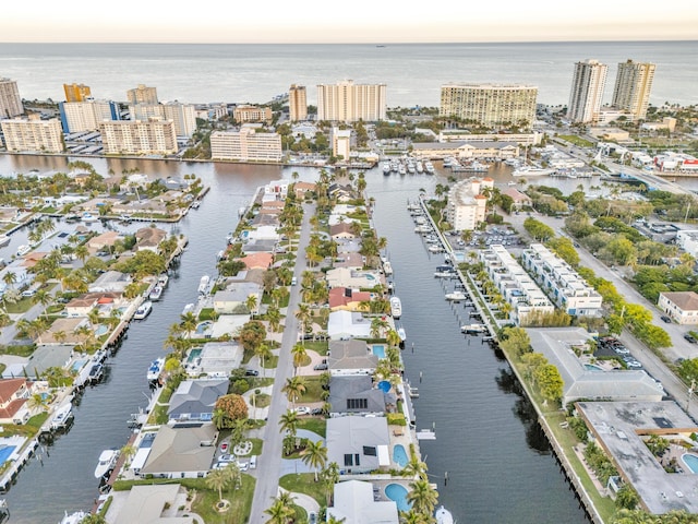 aerial view at dusk with a water view