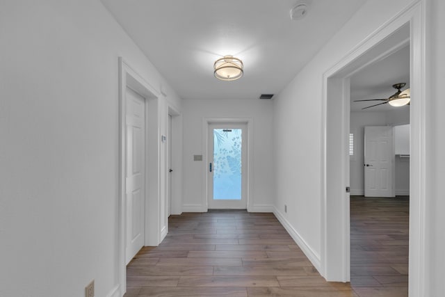 entryway featuring ceiling fan and light hardwood / wood-style flooring