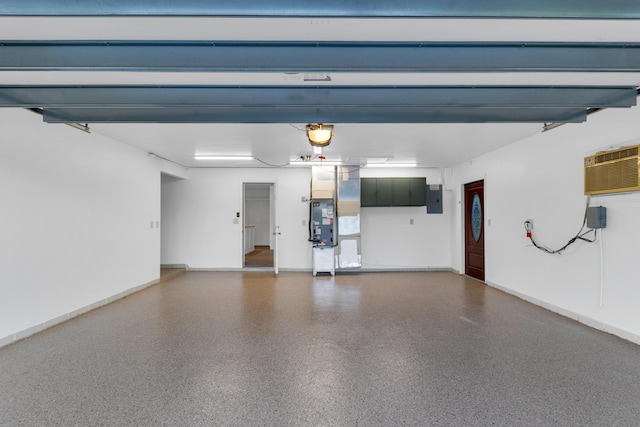 garage with heating unit, a wall mounted air conditioner, and electric panel