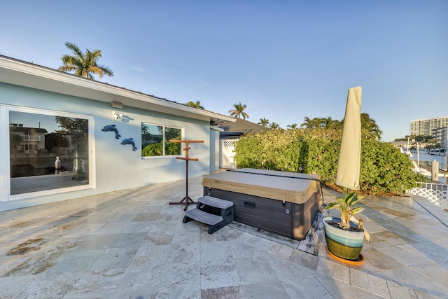 view of patio with a hot tub