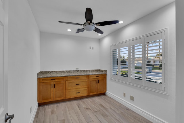 interior space with hardwood / wood-style floors and ceiling fan