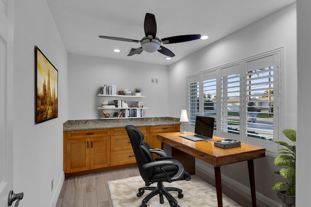 office with ceiling fan and light wood-type flooring