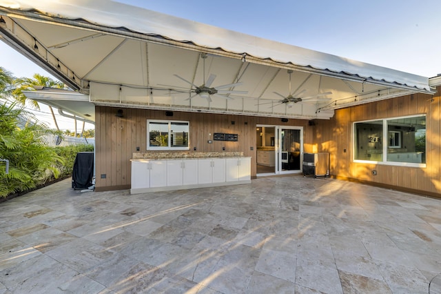 view of patio / terrace featuring ceiling fan