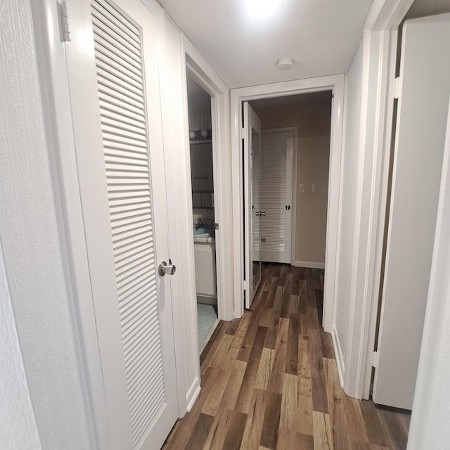 hall with dark hardwood / wood-style floors