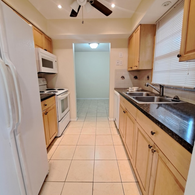 kitchen featuring sink, tasteful backsplash, light tile patterned floors, light brown cabinets, and white appliances