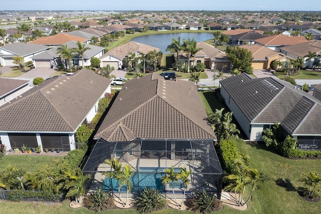 birds eye view of property featuring a water view and a residential view