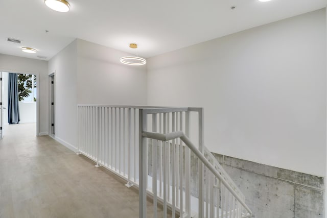 corridor with wood-type flooring