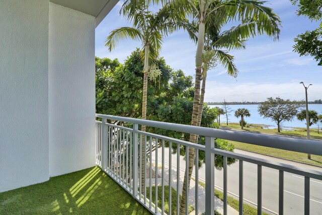 balcony featuring a water view