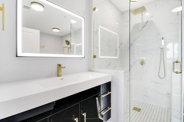 bathroom featuring vanity, an enclosed shower, and toilet