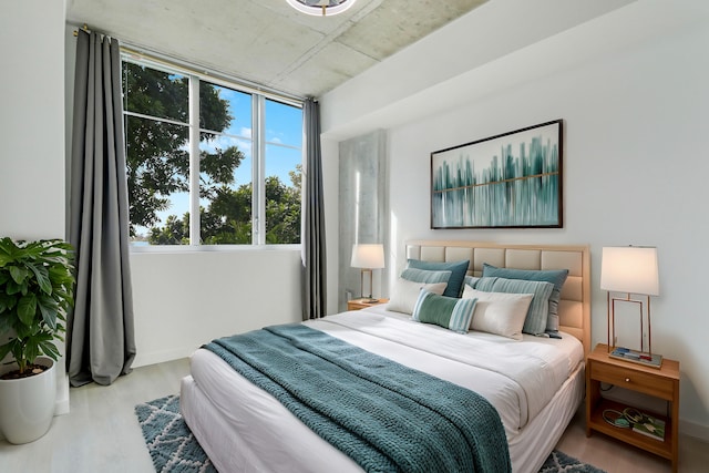 bedroom with wood-type flooring