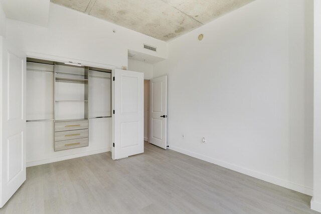 bathroom with toilet and a shower with shower door