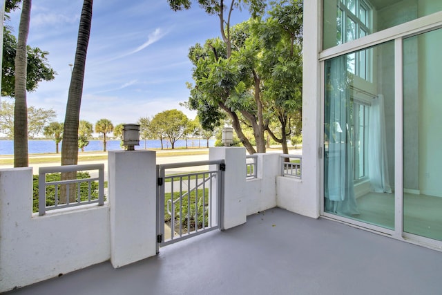 balcony featuring a water view