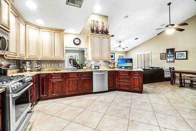 kitchen featuring light tile patterned floors, stainless steel appliances, visible vents, open floor plan, and a peninsula