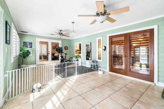 unfurnished sunroom with plenty of natural light, visible vents, and french doors