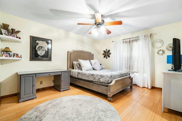 bedroom featuring light wood-type flooring, ceiling fan, and baseboards