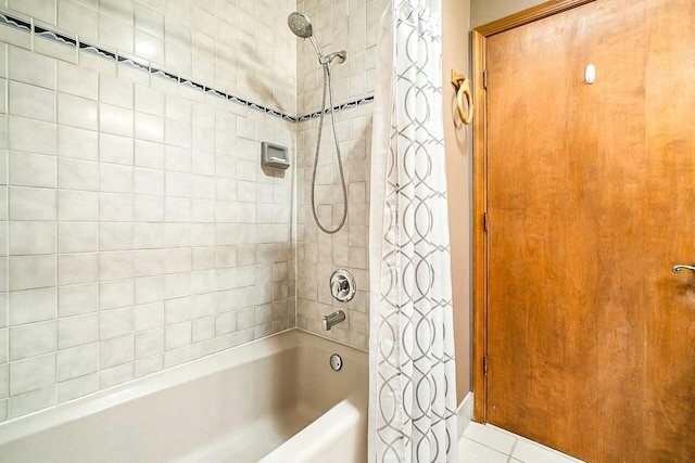 bathroom featuring shower / bath combo and tile patterned flooring