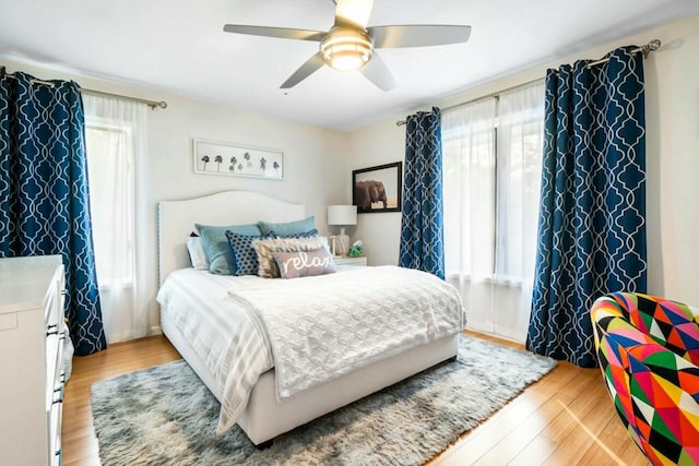 bedroom with ceiling fan and light wood finished floors