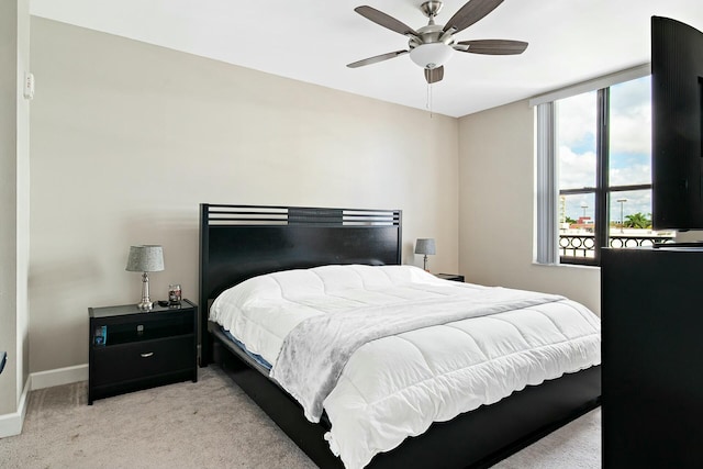 bedroom with light colored carpet and ceiling fan