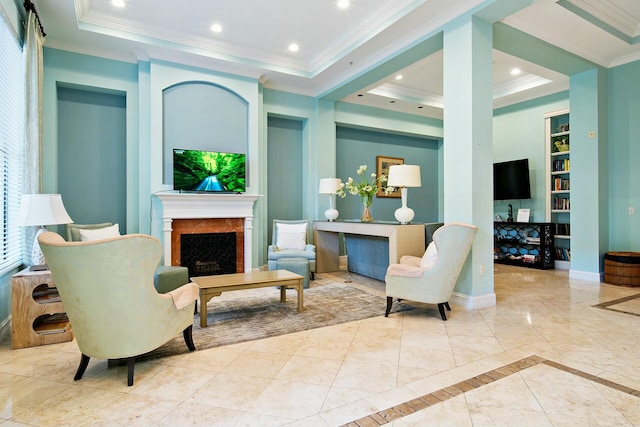 living room featuring a raised ceiling, ornamental molding, built in features, and a high end fireplace