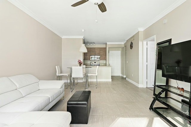 tiled living room with ornamental molding and ceiling fan