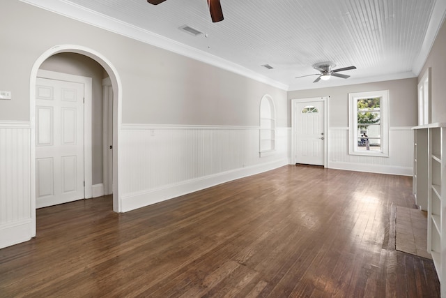 interior space featuring dark hardwood / wood-style flooring, ornamental molding, and ceiling fan