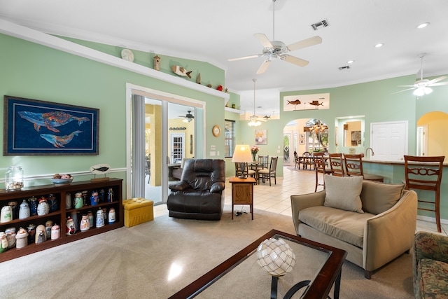 carpeted living room featuring lofted ceiling and ceiling fan