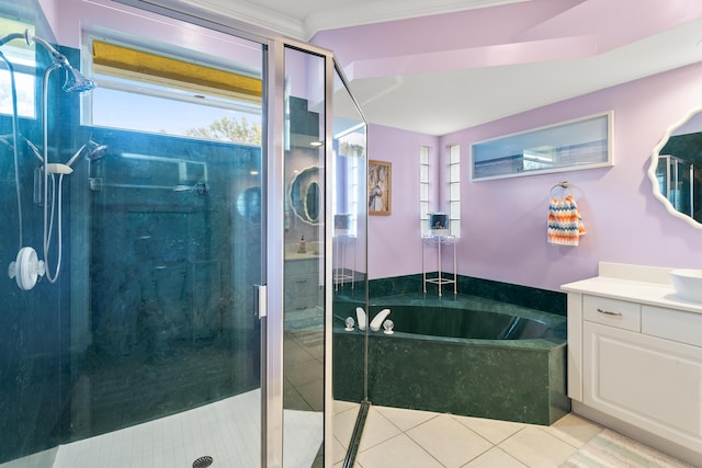 bathroom featuring vanity, plenty of natural light, tile patterned floors, and plus walk in shower