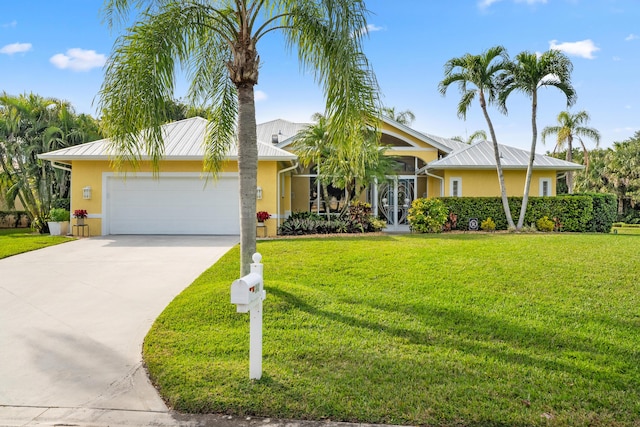 ranch-style home featuring a garage and a front lawn