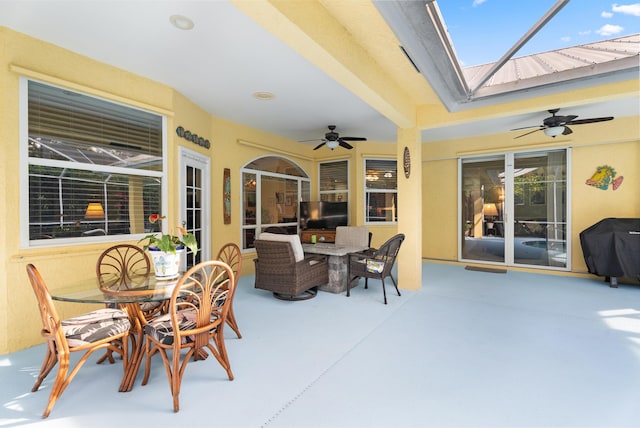 view of patio with a grill and ceiling fan