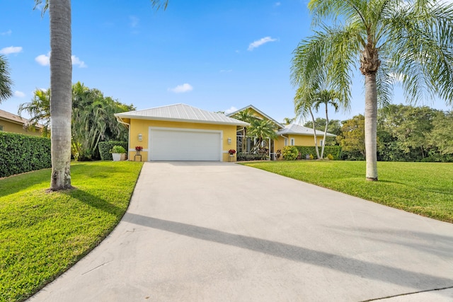 single story home with a garage and a front yard