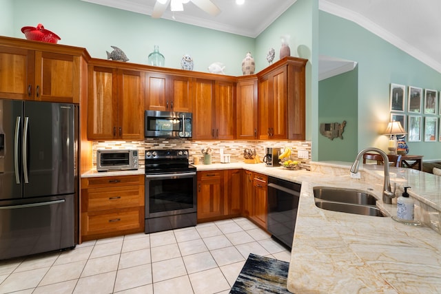 kitchen with crown molding, appliances with stainless steel finishes, sink, and light tile patterned flooring