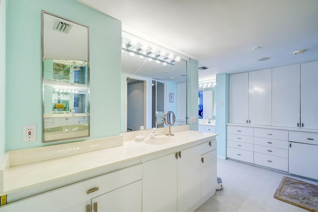 full bath featuring tile patterned flooring, visible vents, and vanity