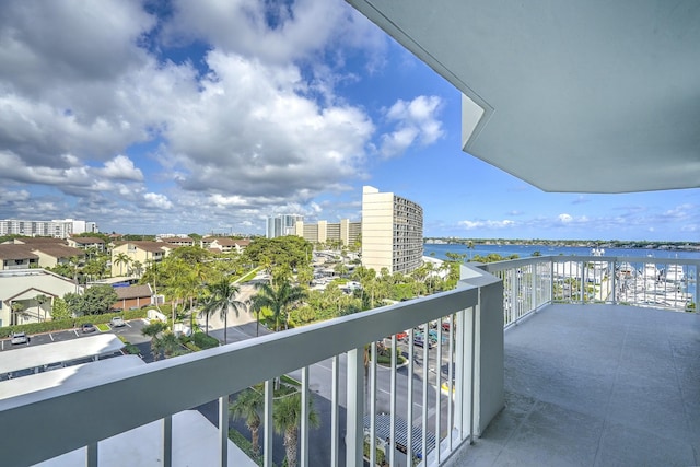 balcony featuring a water view and a view of city