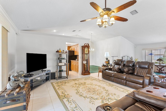 tiled living room with crown molding, vaulted ceiling, and ceiling fan