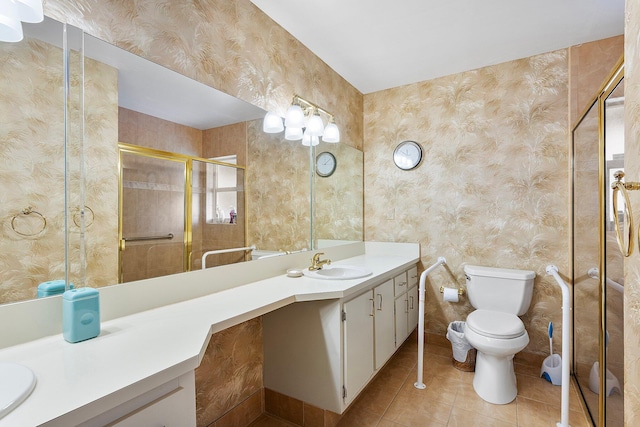 bathroom featuring vanity, tile patterned flooring, a shower with door, and toilet