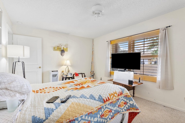 carpeted bedroom with a textured ceiling