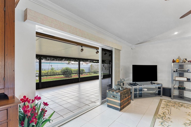 living room featuring crown molding and light tile patterned flooring